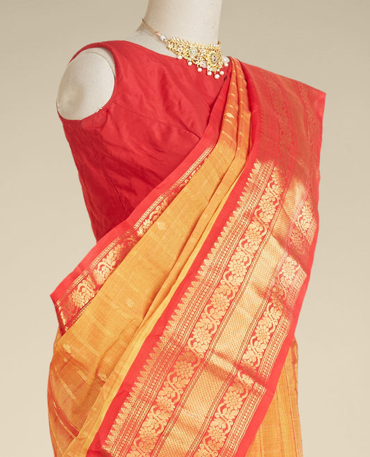 Orange gadwal silk saree with zari designs, contrast traditional design border & pallu of intricate designs