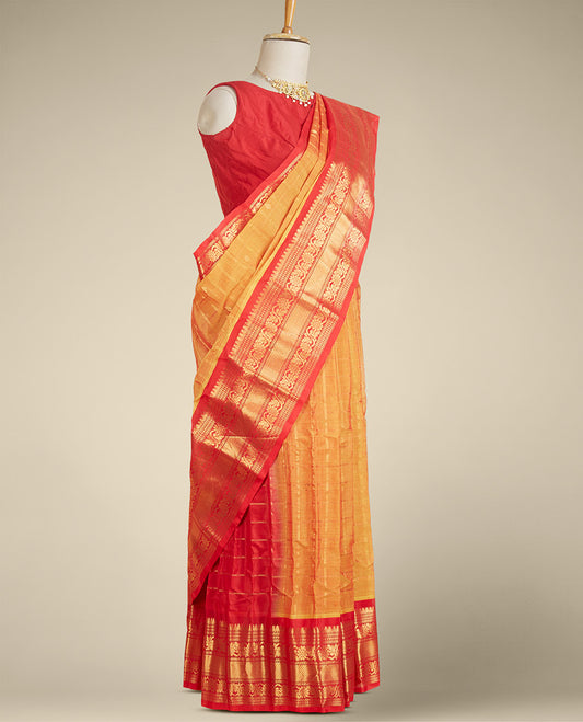 Orange gadwal silk saree with zari designs, contrast traditional design border & pallu of intricate designs