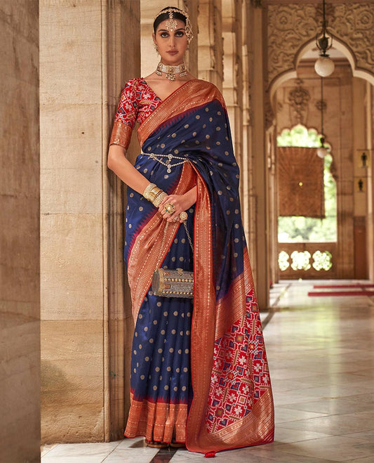 Navy blue chakram zari buttas designer catalog saree, contrast temple traditional zari border, and pallu of double ikkat patola weave
