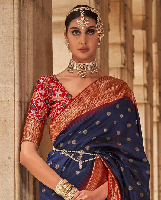 Navy blue chakram zari buttas designer catalog saree, contrast temple traditional zari border, and pallu of double ikkat patola weave