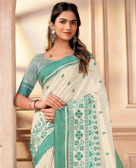 Cream floral embroidered designer saree, contrast jamdani style embroidered border, and striped pallu