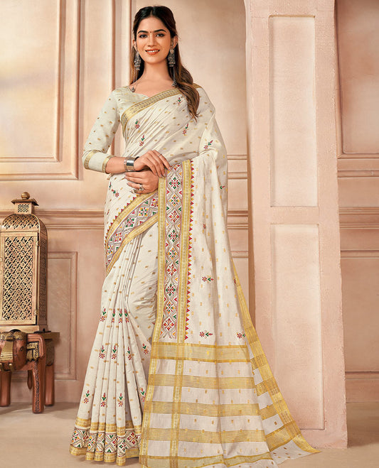 Cream buttas and floral embroidered designer saree, traditional motifs and embroidered border, and pallu of stripes and buttas