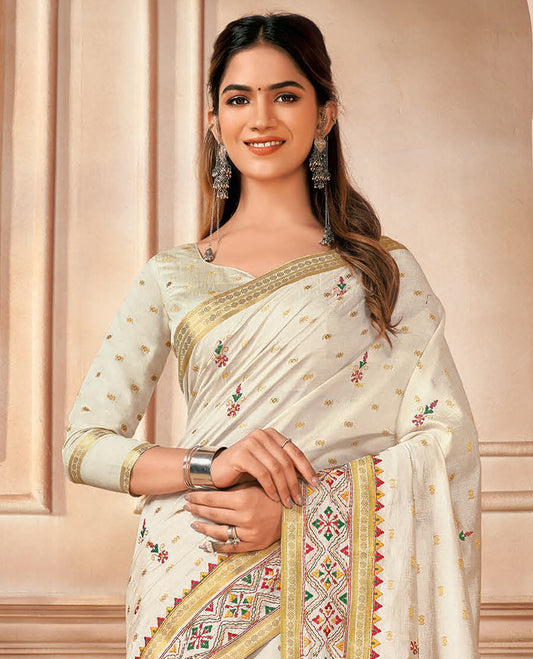 Cream buttas and floral embroidered designer saree, traditional motifs and embroidered border, and pallu of stripes and buttas