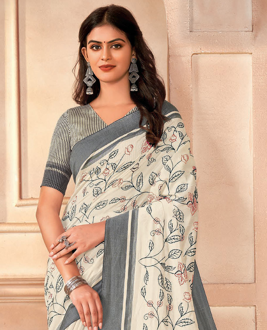 Cream floral vine embroidered designer saree, contrast border, and pallu of stripes
