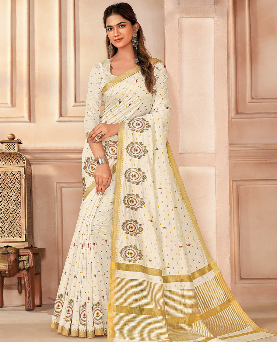 Cream buttas and embroidered designer saree, temple border, and pallu of stripes