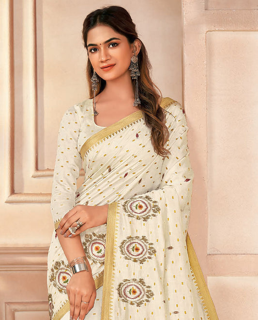 Cream buttas and embroidered designer saree, temple border, and pallu of stripes