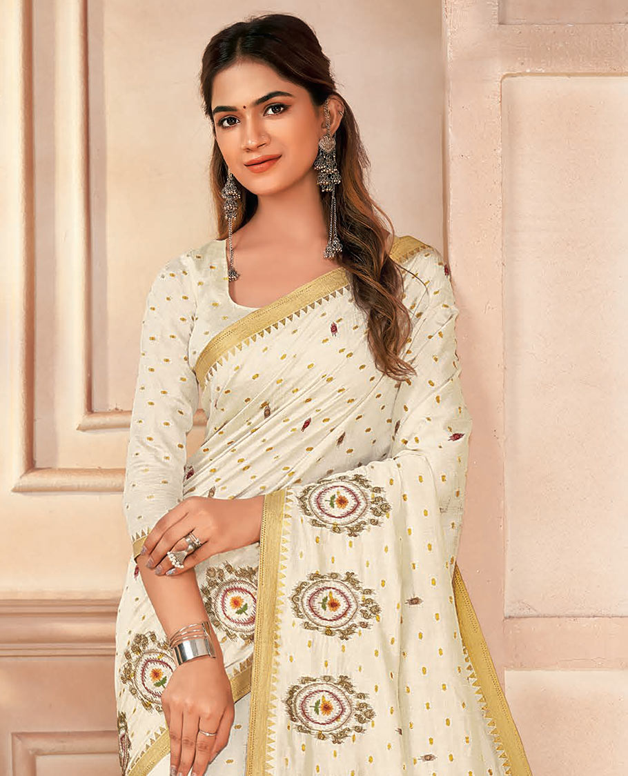 Cream buttas and embroidered designer saree, temple border, and pallu of stripes