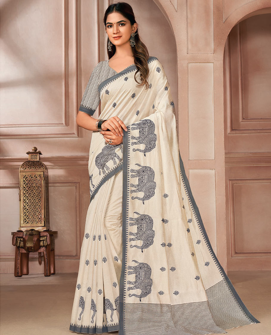 Cream elephant motifs embroidered designer saree, contrast temple border, and pallu of stripes