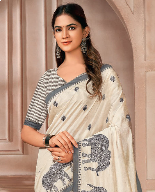 Cream elephant motifs embroidered designer saree, contrast temple border, and pallu of stripes
