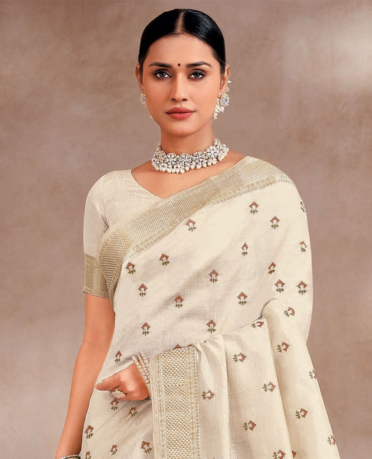 Cream buttas embroidered designer saree, traditional zari border and striped pallu