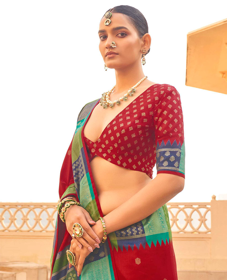 Maroon Designer Saree, Decked Up with Buttas, Complemented by a Contrast Temple Multi-Color Butta Woven Border, Intricate Pallu, and a Matching Blouse
