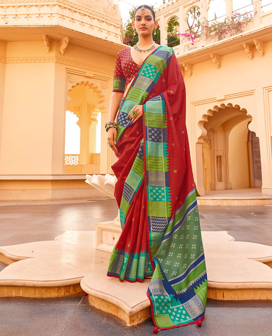 Maroon Designer Saree, Decked Up with Buttas, Complemented by a Contrast Temple Multi-Color Butta Woven Border, Intricate Pallu, and a Matching Blouse