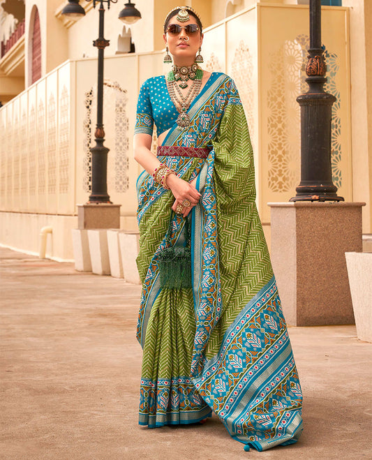 Green-blue patola chevron striped designer catalog saree, contrast diamond ikkat border, and pallu of diamond patterns