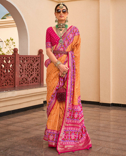 Orange-pink patola chevron striped designer catalog saree, contrast diamond ikkat border, and pallu of diamond patterns