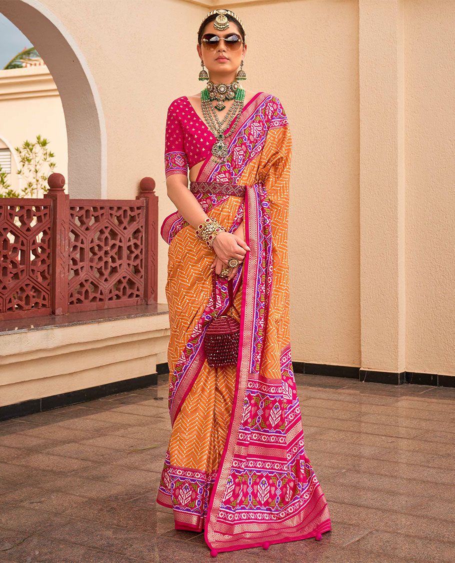 Orange-pink patola chevron striped designer catalog saree, contrast diamond ikkat border, and pallu of diamond patterns