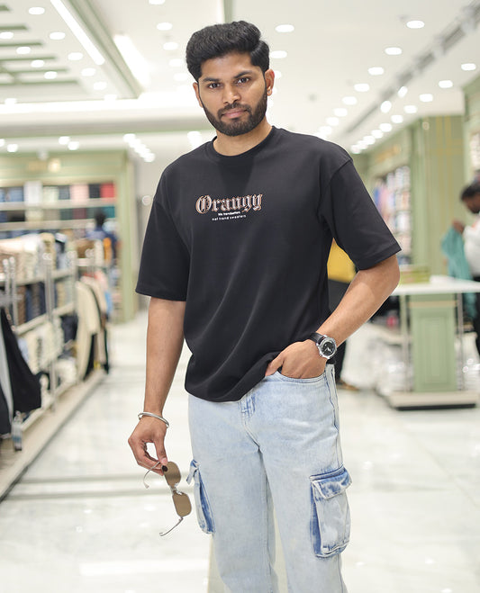 Black Glow in the Dark Cotton-Blended T-Shirt, Elevated with Colorful Cartoon Motifs Print, Comes with a Crew Neck, Half-Sleeves, Oversized Fit, and Long Length