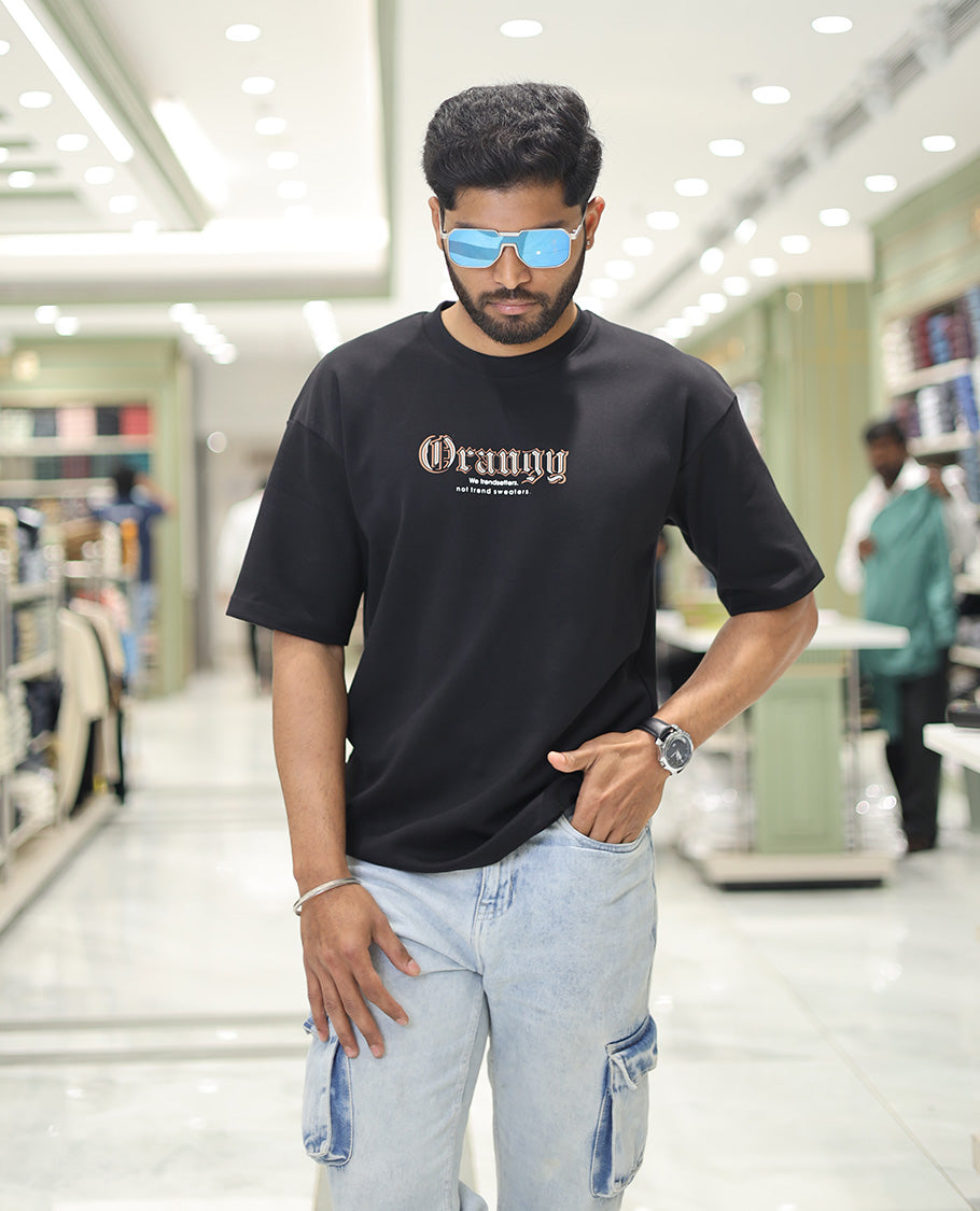 Black Glow in the Dark Cotton-Blended T-Shirt, Elevated with Colorful Cartoon Motifs Print, Comes with a Crew Neck, Half-Sleeves, Oversized Fit, and Long Length