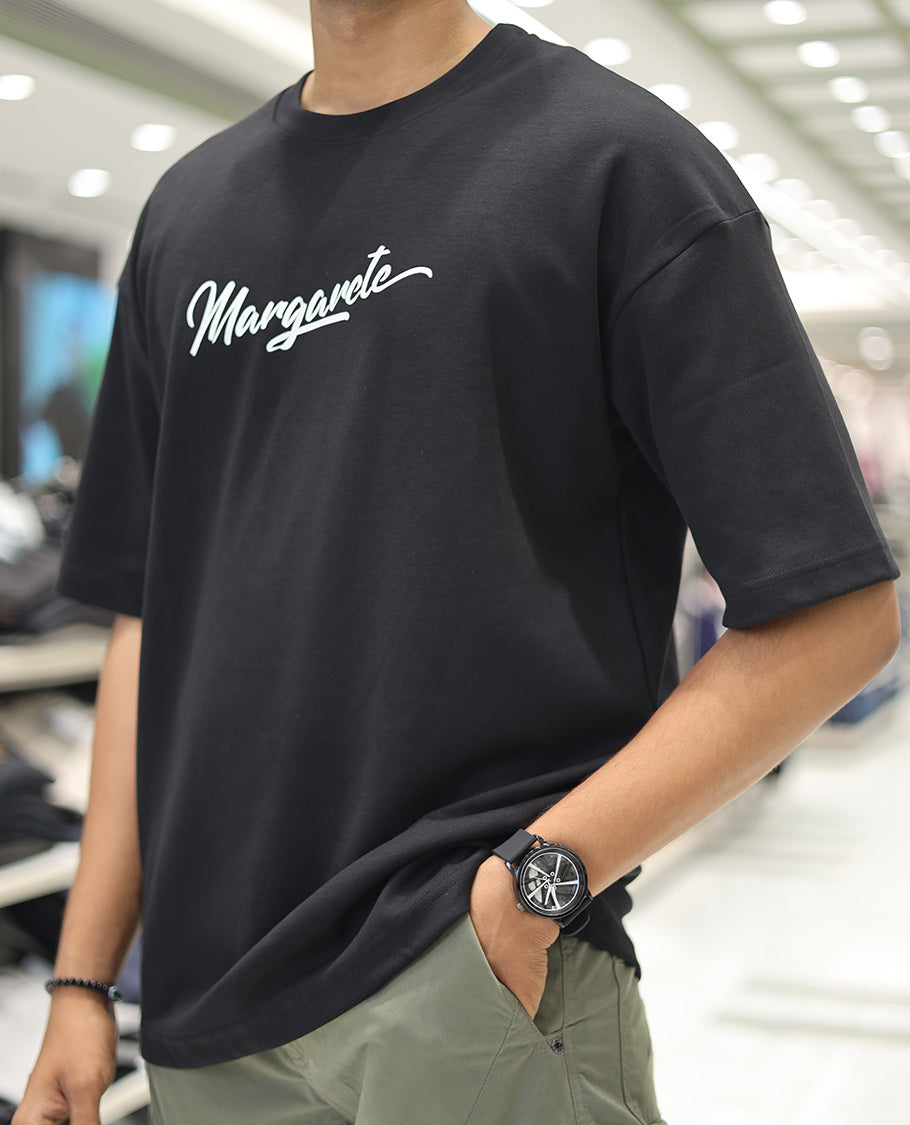 Black Glow in the Dark Cotton-Blended T-Shirt, Accentuated with Colorful Cartoon Motifs Print, Comes with a Crew Neck, Half-Sleeves, Oversized Fit, and Long Length