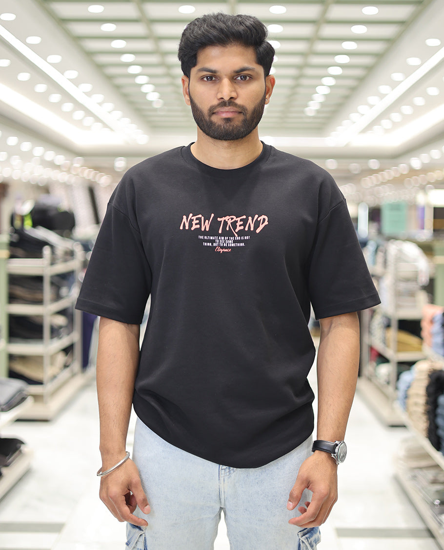 Black Glow in the Dark Cotton-Blended T-Shirt, Decked Up with Colorful Cartoon Motifs Print, Comes with a Crew Neck, Half-Sleeves, Oversized Fit, and Long Length