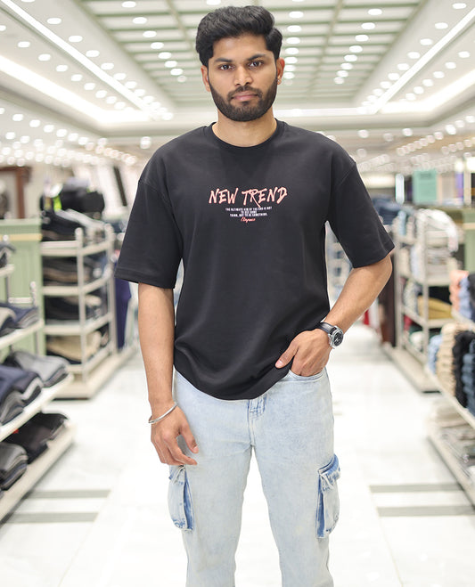 Black Glow in the Dark Cotton-Blended T-Shirt, Decked Up with Colorful Cartoon Motifs Print, Comes with a Crew Neck, Half-Sleeves, Oversized Fit, and Long Length