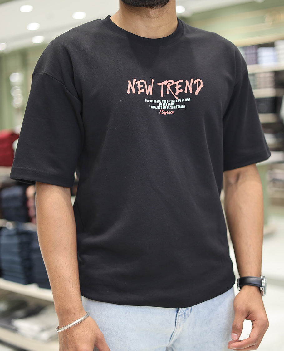Black Glow in the Dark Cotton-Blended T-Shirt, Decked Up with Colorful Cartoon Motifs Print, Comes with a Crew Neck, Half-Sleeves, Oversized Fit, and Long Length