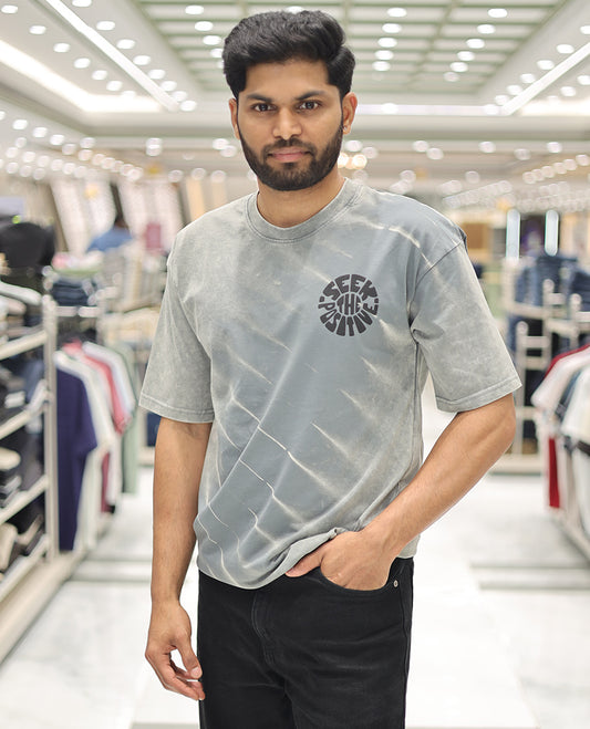 Green Cotton-Blended T-Shirt, Elevated with Typography Print, Comes with a Crew Neck, Half-Sleeves, Oversized Fit, and Long Length
