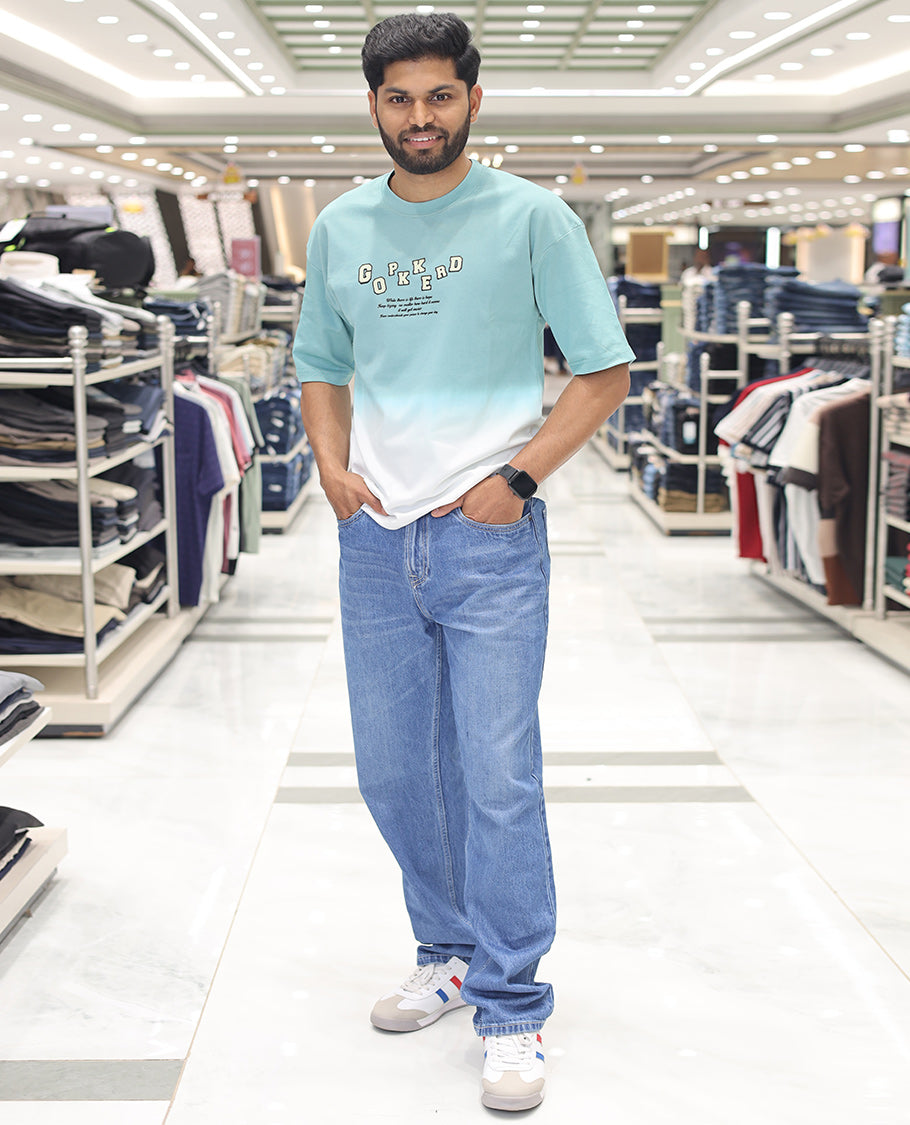 Teal Cotton-Blended Ombre T-Shirt, Artfully Detailed with Funky Motifs and Typography Prints, Comes with a Crew Neck, Half-Sleeves, Oversized Fit, and Long Length