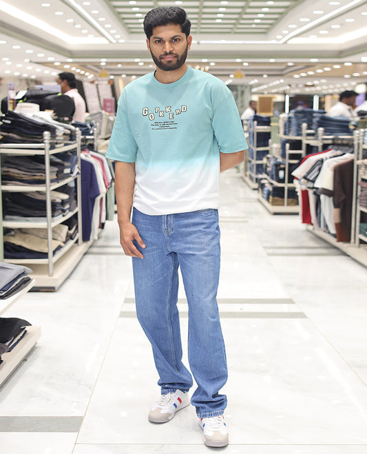 Teal Cotton-Blended Ombre T-Shirt, Artfully Detailed with Funky Motifs and Typography Prints, Comes with a Crew Neck, Half-Sleeves, Oversized Fit, and Long Length