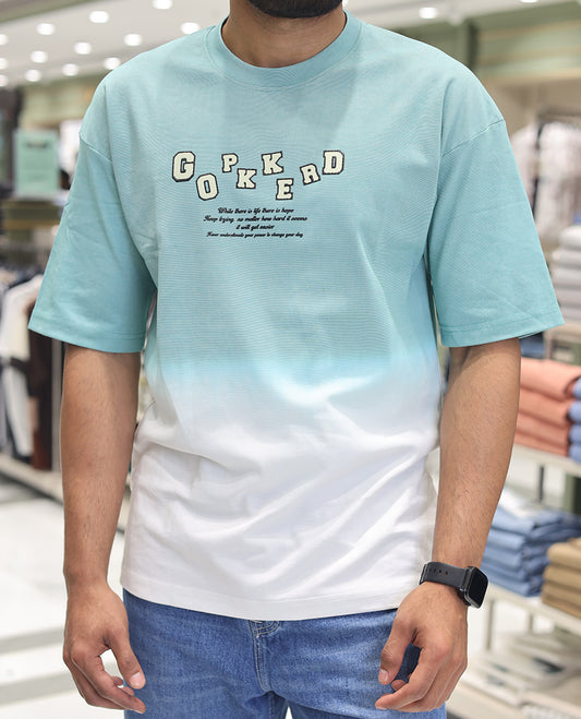 Teal Cotton-Blended Ombre T-Shirt, Artfully Detailed with Funky Motifs and Typography Prints, Comes with a Crew Neck, Half-Sleeves, Oversized Fit, and Long Length