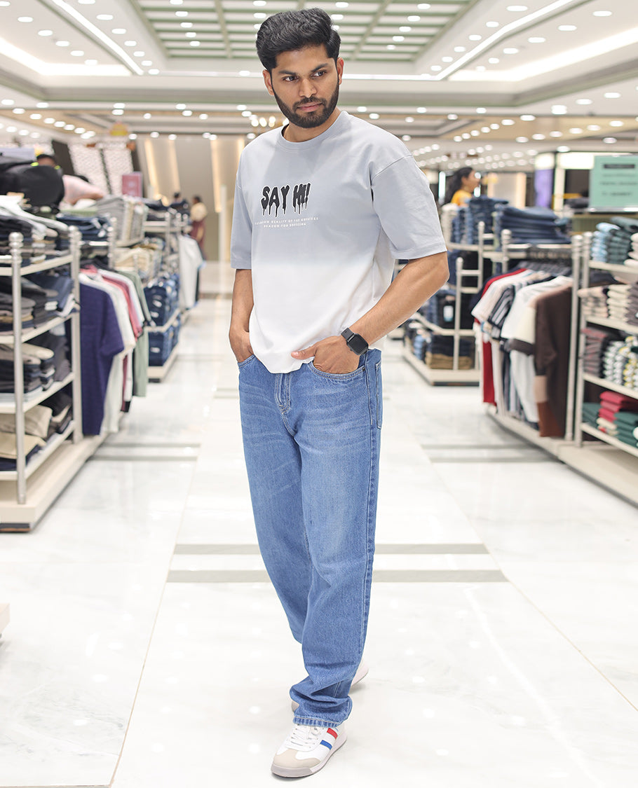 Grey Cotton-Blended Ombre T-Shirt, Artfully Detailed with Funky Motifs and Typography Prints, Comes with a Crew Neck, Half-Sleeves, Oversized Fit, and Long Length