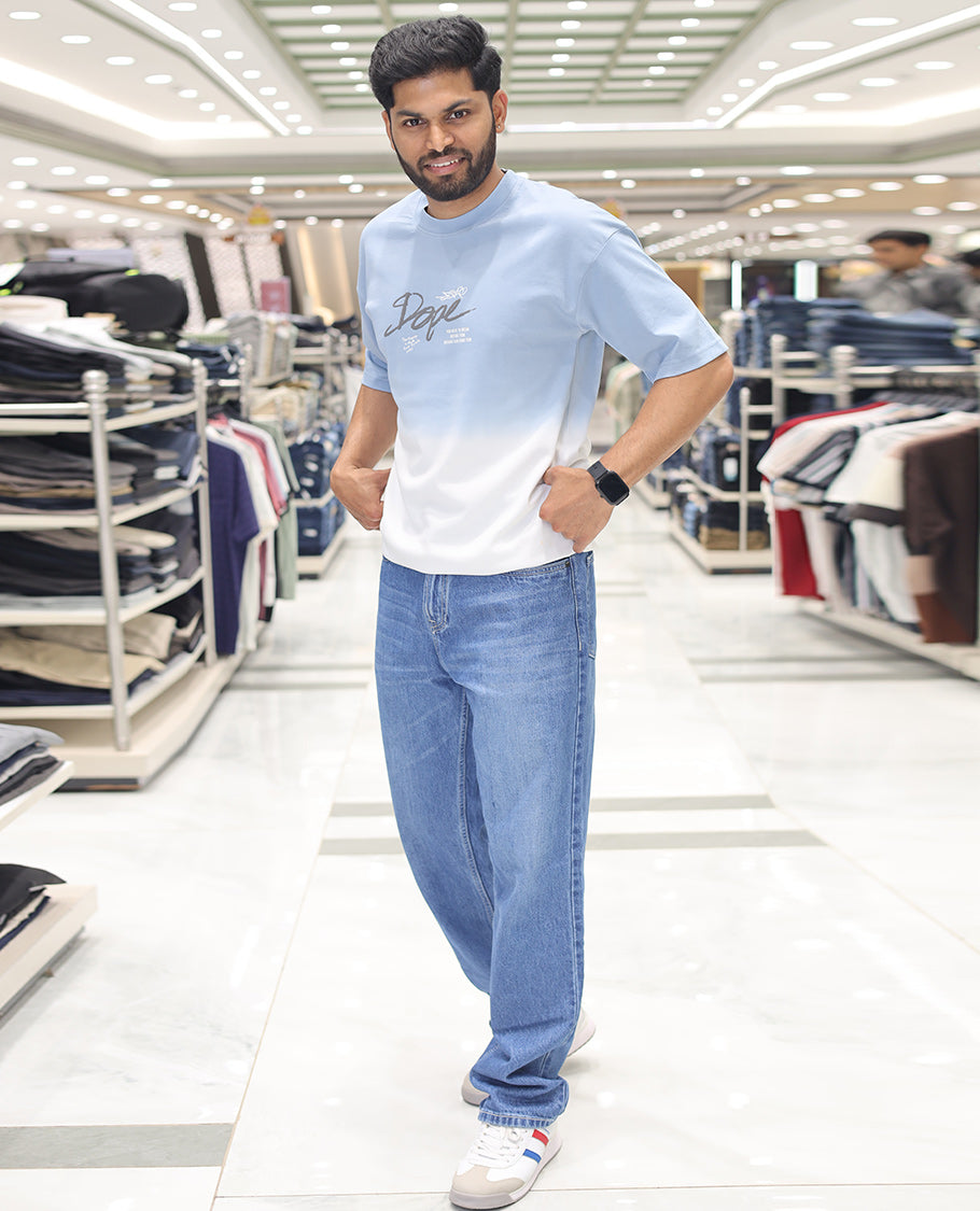 Light Blue Cotton-Blended Ombre T-Shirt, Artfully Detailed with Funky Motifs and Typography Prints, Comes with a Crew Neck, Half-Sleeves, Oversized Fit, and Long Length