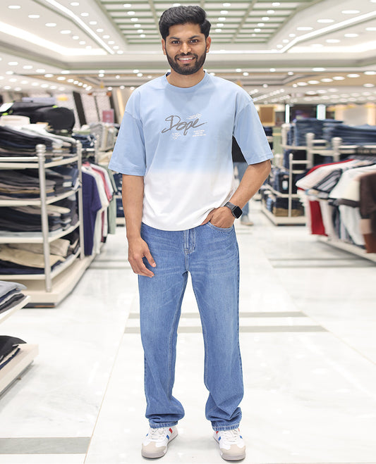 Light Blue Cotton-Blended Ombre T-Shirt, Artfully Detailed with Funky Motifs and Typography Prints, Comes with a Crew Neck, Half-Sleeves, Oversized Fit, and Long Length