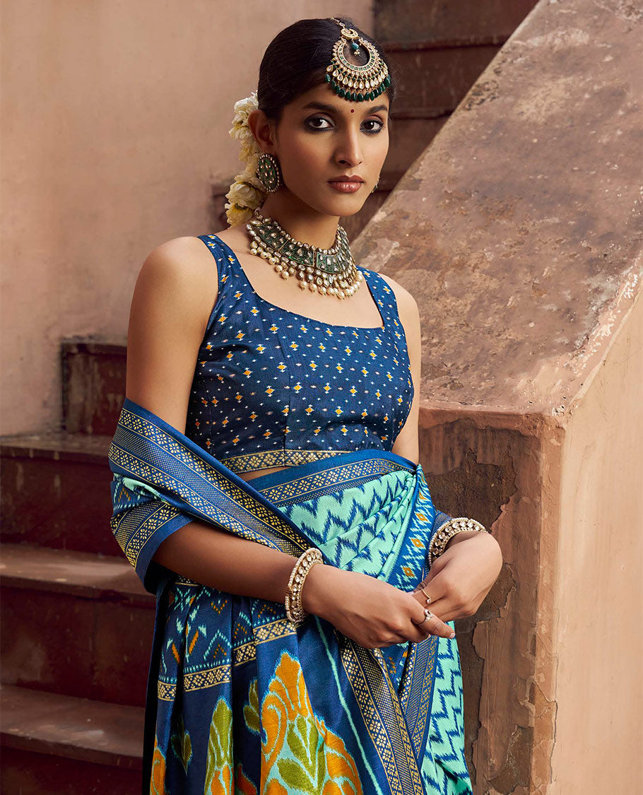 Turquoise Ikat Patola Designer Saree, Adorned with Ikat Chevron Stripes, Complemented by a Contrast Ikat Border, Ikat Woven Pallu, and a Contrast Blouse