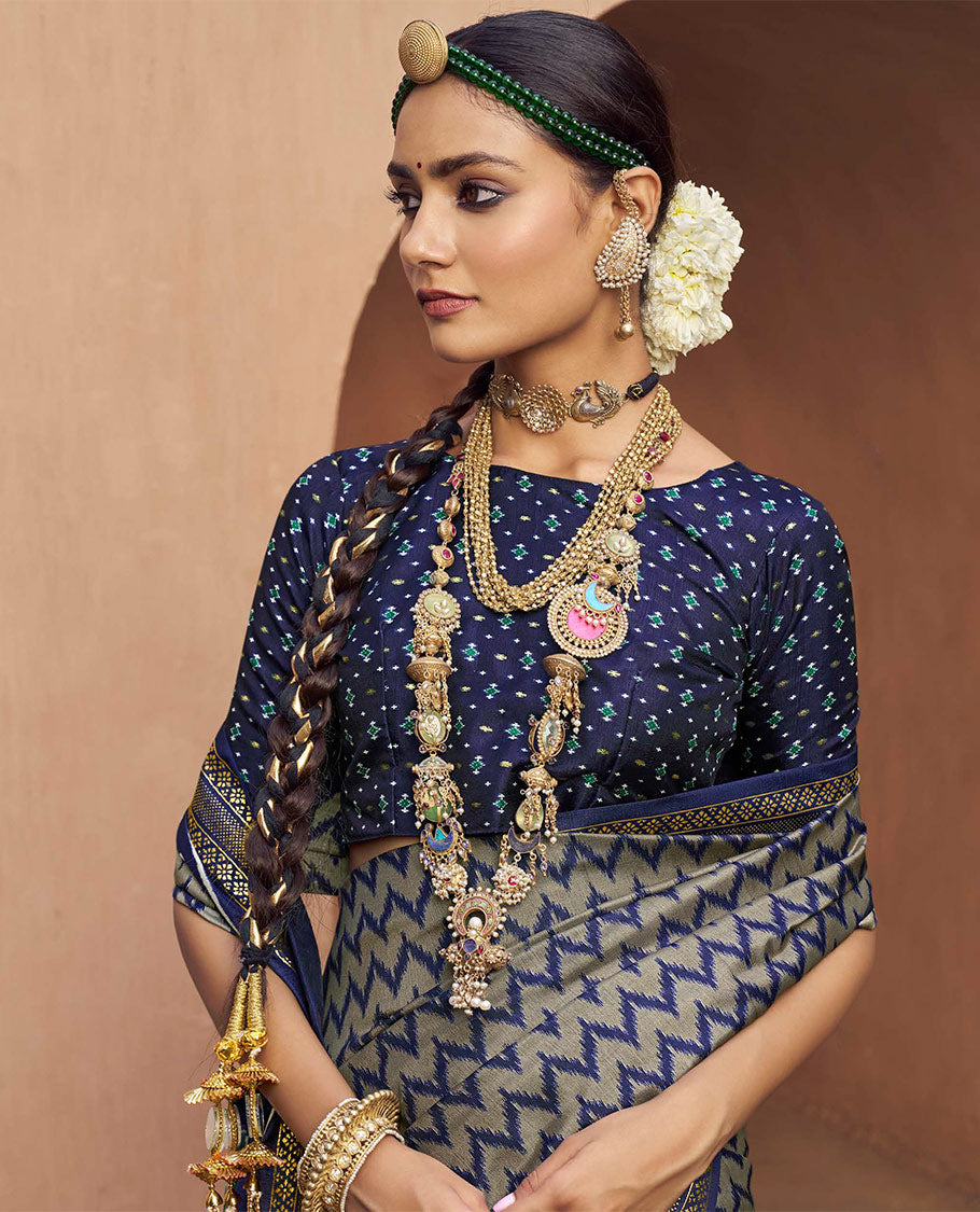 Grey-Blue Ikat Patola Designer Saree, Adorned with Ikat Chevron Stripes, Complemented by a Contrast Ikat Border, Ikat Woven Pallu, and a Contrast Blouse