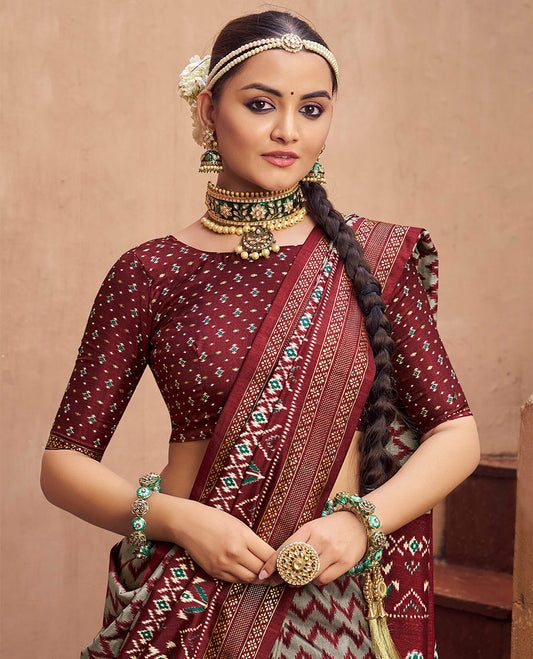 Grey-Maroon Ikat Patola Designer Saree, Adorned with Ikat Chevron Stripes, Complemented by a Contrast Ikat Border, Ikat Woven Pallu, and a Contrast Blouse