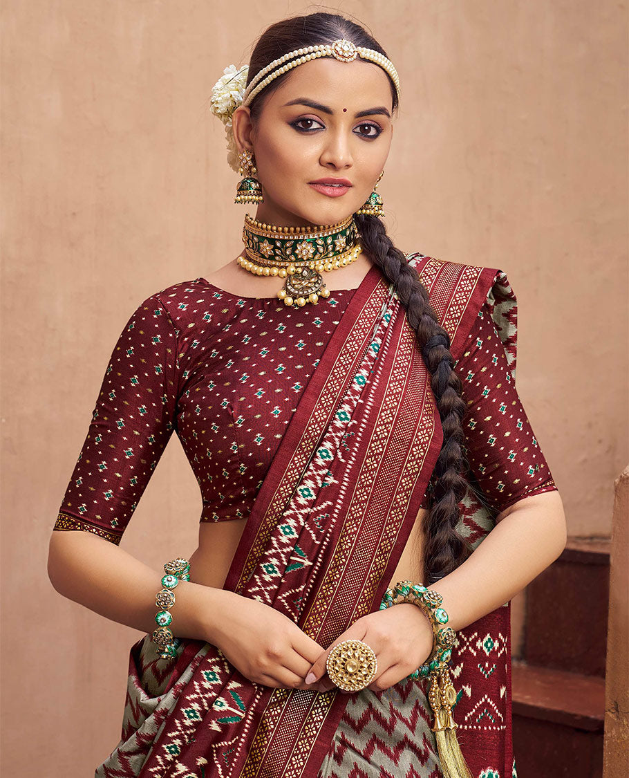 Grey-Maroon Ikat Patola Designer Saree, Adorned with Ikat Chevron Stripes, Complemented by a Contrast Ikat Border, Ikat Woven Pallu, and a Contrast Blouse