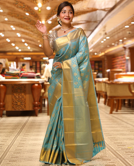 Sky Blue Budget Silk Saree, Enriched with Zari Buttas All Over Its Body, Highlighted by Traditional Zari Designs Woven Border, Grand Pallu, Paired with a Matching Blouse - Inspired by Trisha Blue Saree