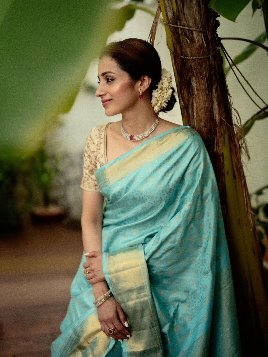 Blue Samudrika Silk Saree, Steeped in the Richness of Zari Buttas All Over Its Body, Highlighted by a Zari Border of Thilakam Mokku, Banaras, Muthu, Lathir, and Mayil Kann Designs, Gleaming Grand Pallu, and Paired with a Matching Blouse
