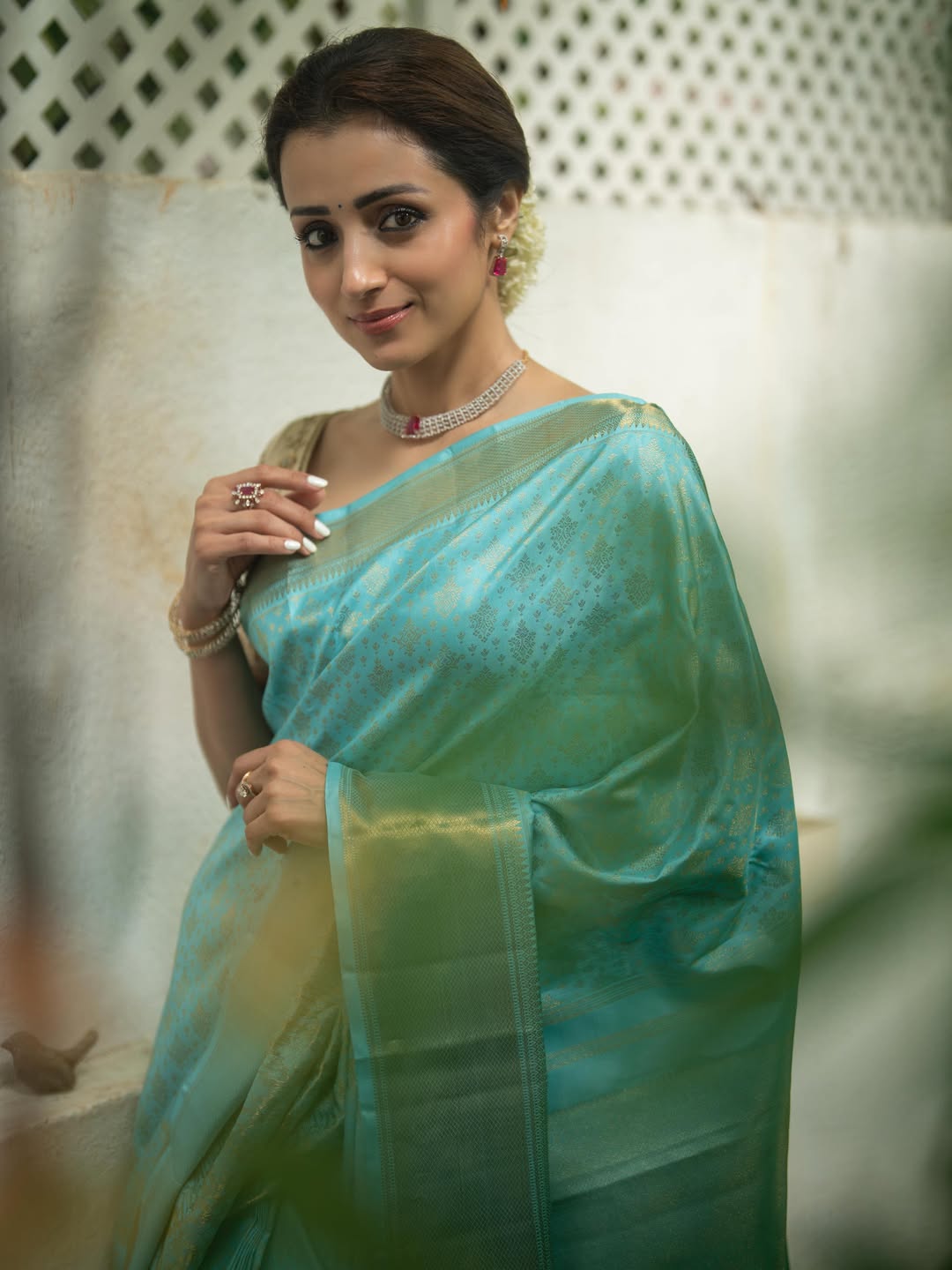 Blue Samudrika Silk Saree, Steeped in the Richness of Zari Buttas All Over Its Body, Highlighted by a Zari Border of Thilakam Mokku, Banaras, Muthu, Lathir, and Mayil Kann Designs, Gleaming Grand Pallu, and Paired with a Matching Blouse
