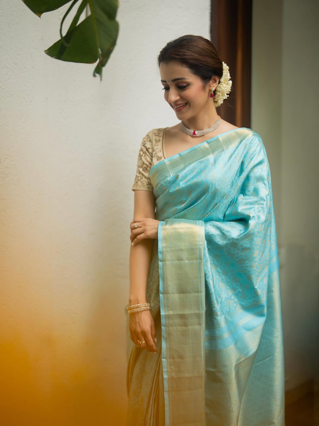 Blue Samudrika Silk Saree, Steeped in the Richness of Zari Buttas All Over Its Body, Highlighted by a Zari Border of Thilakam Mokku, Banaras, Muthu, Lathir, and Mayil Kann Designs, Gleaming Grand Pallu, and Paired with a Matching Blouse