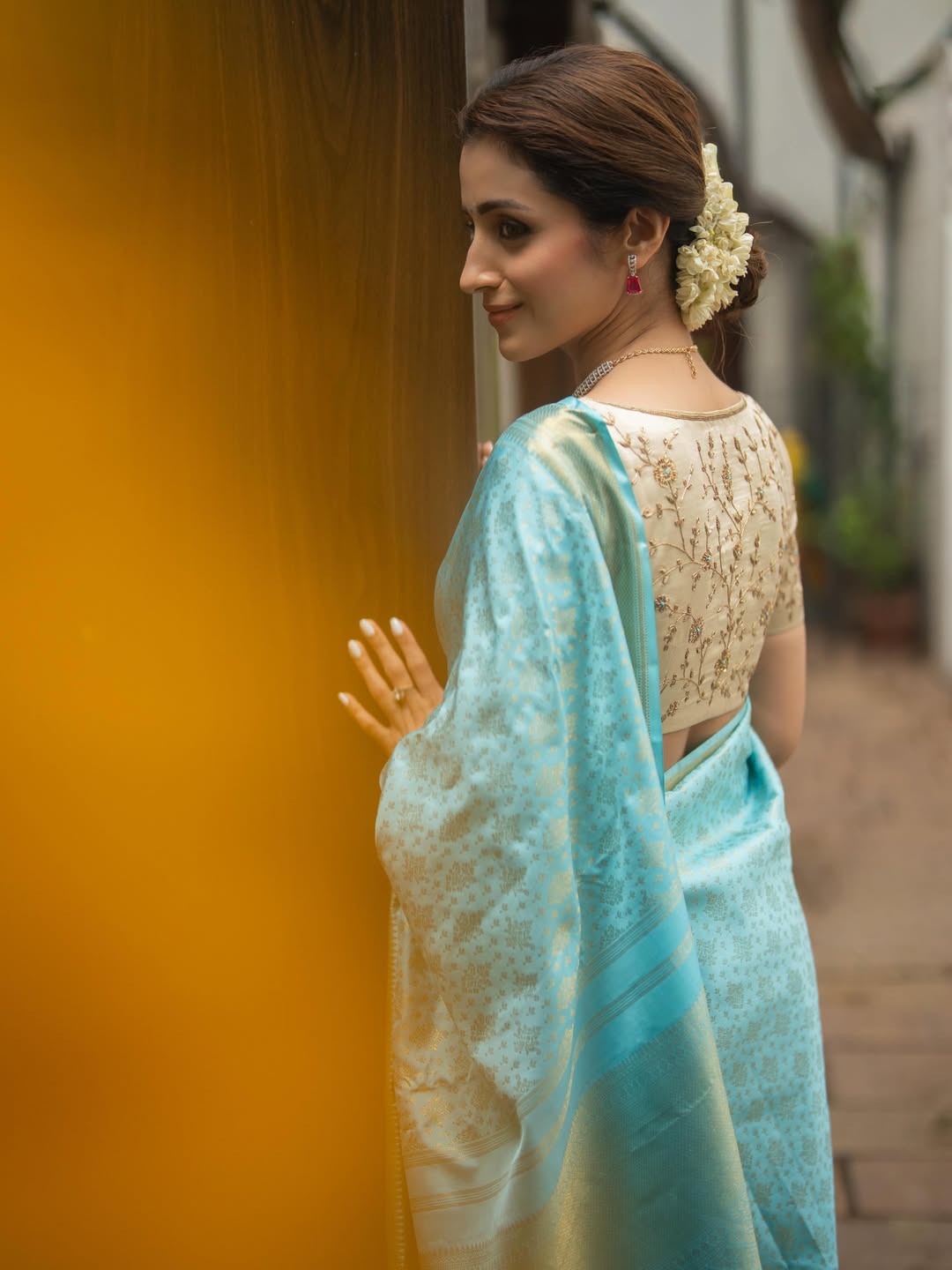 Blue Samudrika Silk Saree, Steeped in the Richness of Zari Buttas All Over Its Body, Highlighted by a Zari Border of Thilakam Mokku, Banaras, Muthu, Lathir, and Mayil Kann Designs, Gleaming Grand Pallu, and Paired with a Matching Blouse