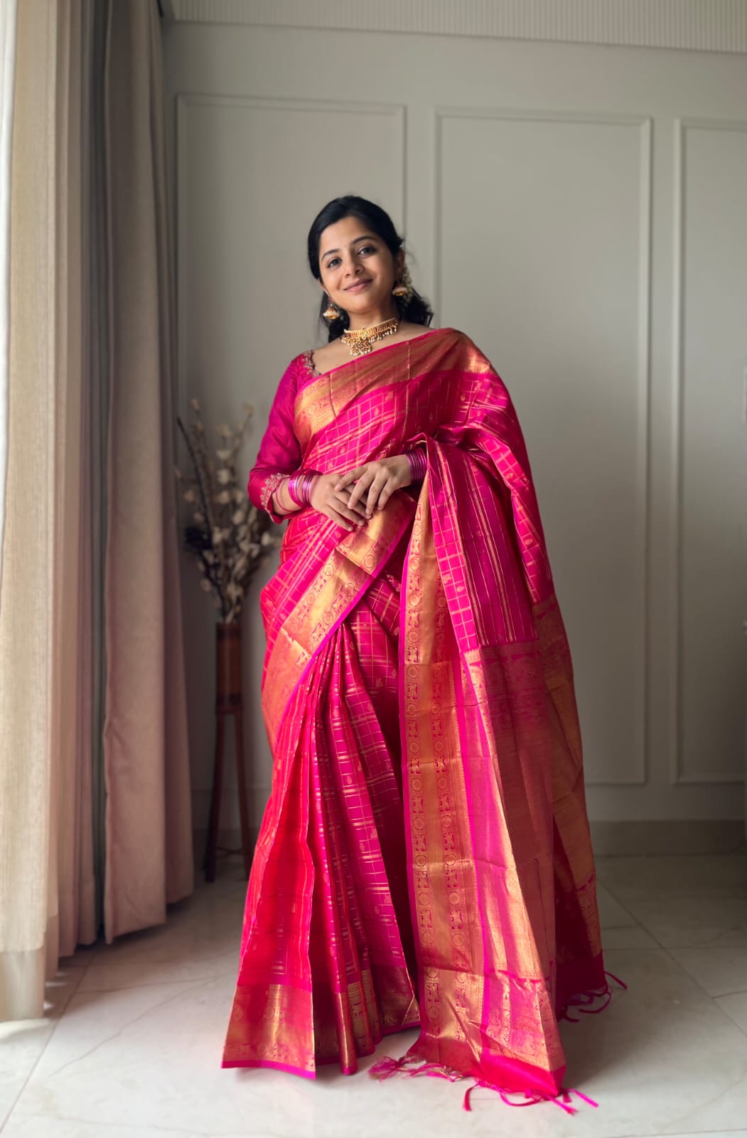 Pink Zari Butta Enclosed Checked Vasundhara Silksaree, a Zari Kuthirai-Chakra Border, a Matching Blouse