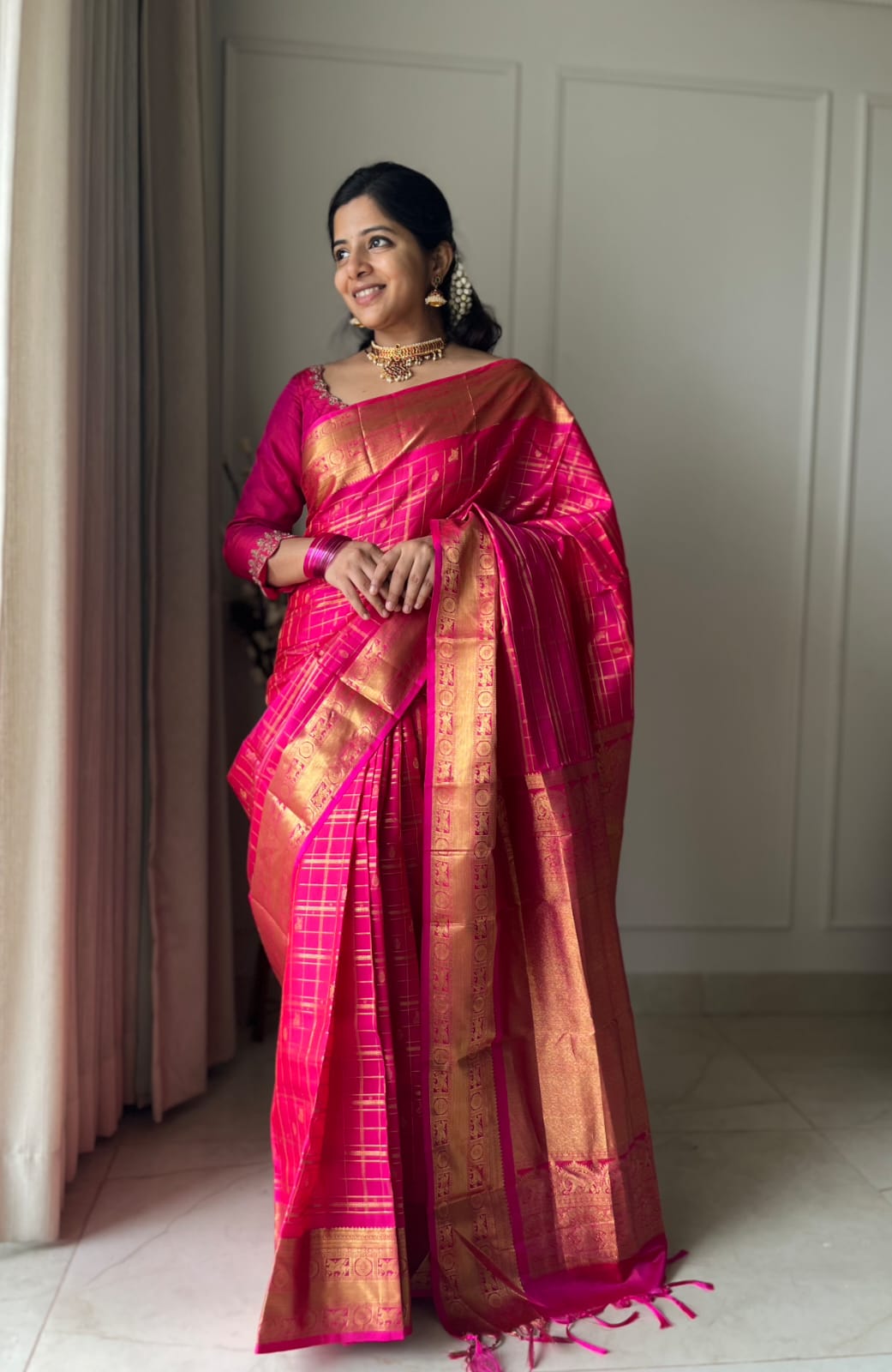Pink Zari Butta Enclosed Checked Vasundhara Silksaree, a Zari Kuthirai-Chakra Border, a Matching Blouse