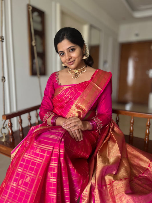 Pink Zari Butta Enclosed Checked Vasundhara Silksaree, a Zari Kuthirai-Chakra Border, a Matching Blouse
