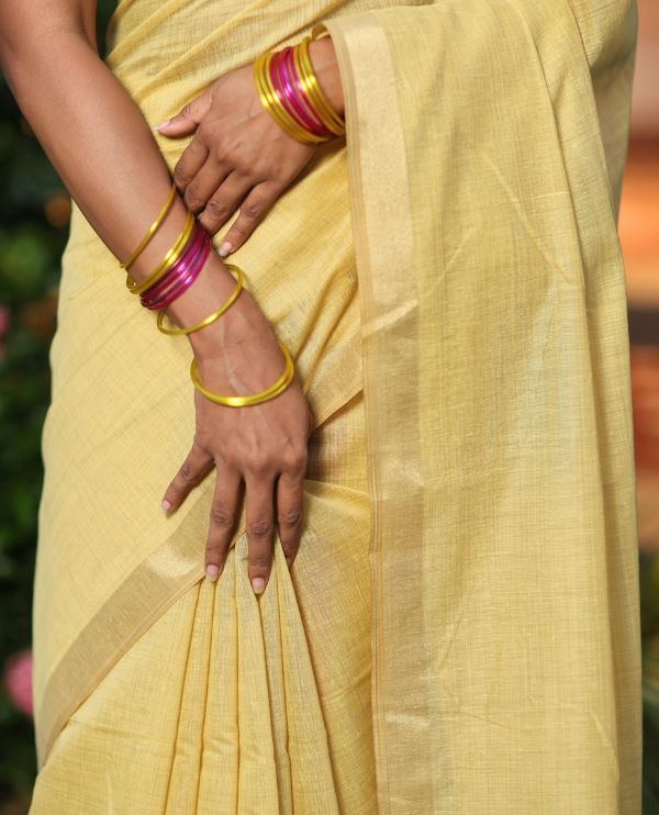 Yellow Plain Semi-Tussar Saree, a Zari Border, Multi-Colored Striped Pallu, and a Contrast Blouse