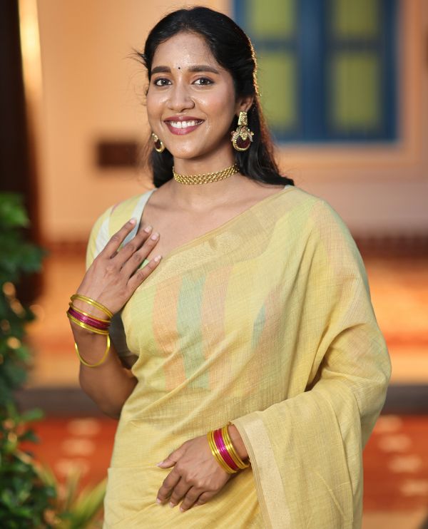Yellow Plain Semi-Tussar Saree, a Zari Border, Multi-Colored Striped Pallu, and a Contrast Blouse