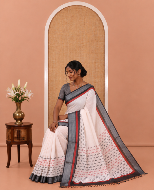 Cream Linen Cotton Saree Artfully Printed with Fish Motifs, a Contrast Border, a Fish-Printed Pallu, and a Contrast Blouse
