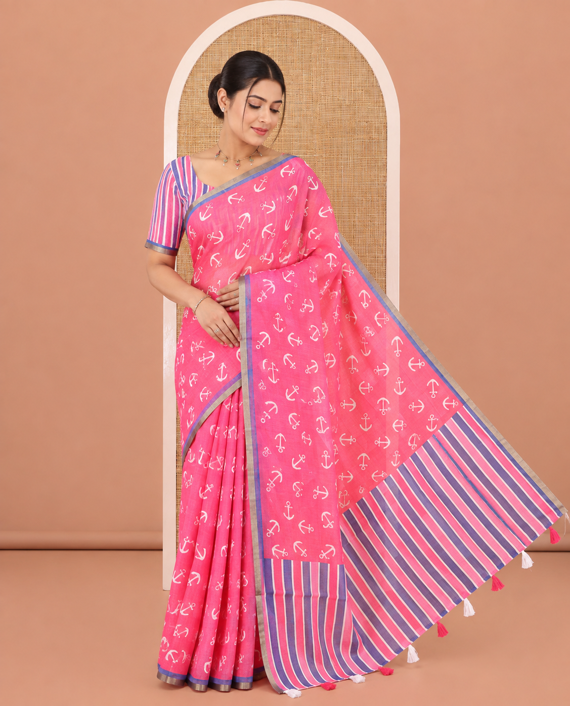 Rani Pink Linen Cotton Saree, Accentuated with Anchor Motifs Printed on Its Body, a Subtle Contrast Piping Border, Multi-Color Striped Pallu, and Paired with a Contrast Blouse