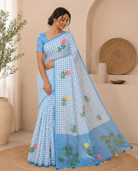 Borderless blue linen Cotton Saree, Graced with Rose Floral Buttas and Checked Design on Its Body, Pallu Pictures a Beautiful Rose Floral Motifs, and Paired with a Matching Blouse