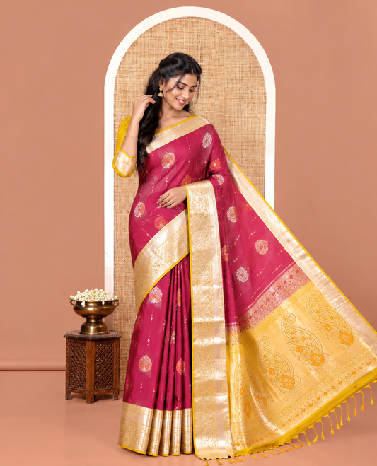 Majenta Semi-Soft Silk Saree, Opulently Embellished with Zari Designs All Over Its Body, Complemented by Contrast Traditional Zari Design Border, Pallu of Big Paisleys, and Paired with a Contrast Blouse